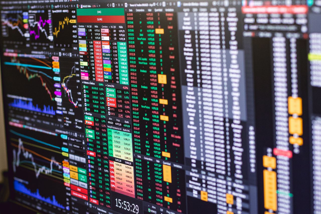 services-01 Detailed financial trading screen with colorful charts and data representing market fluctuations.